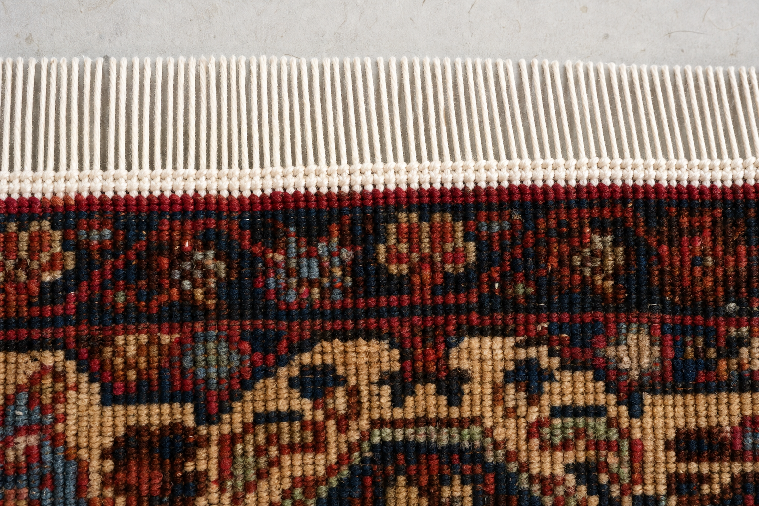 New warp foundation threads rebuilt and rewoven at the end of a rug