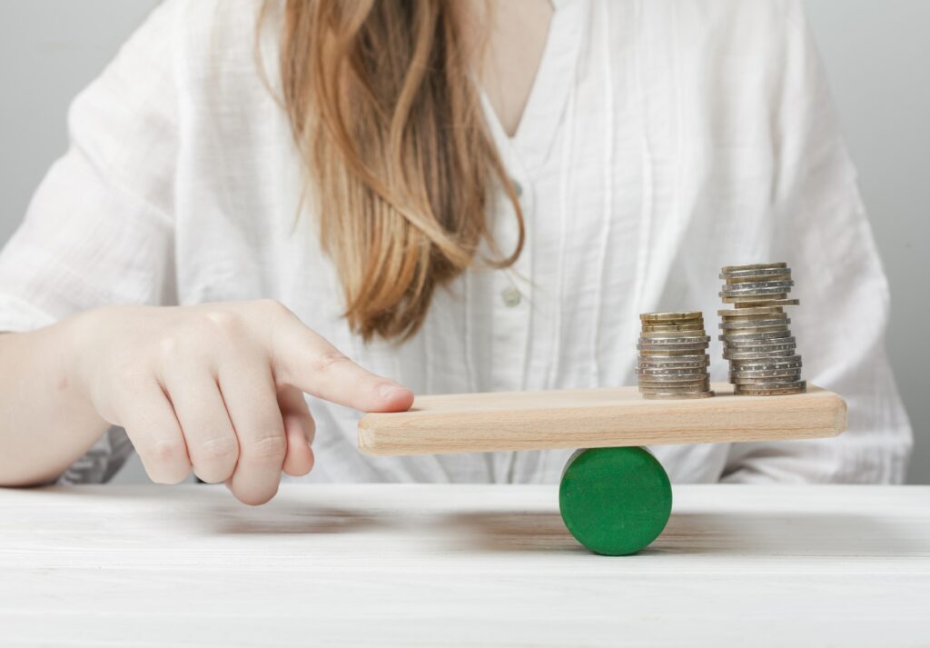 woman balancing coins